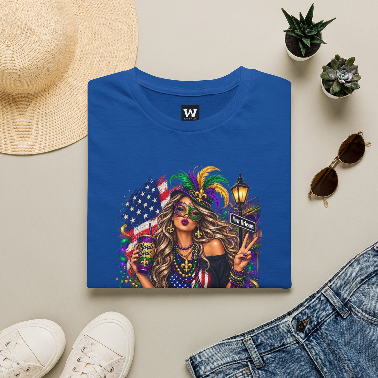 Royal blue T-shirt with Mardi Gras queen and American flag graphic on front