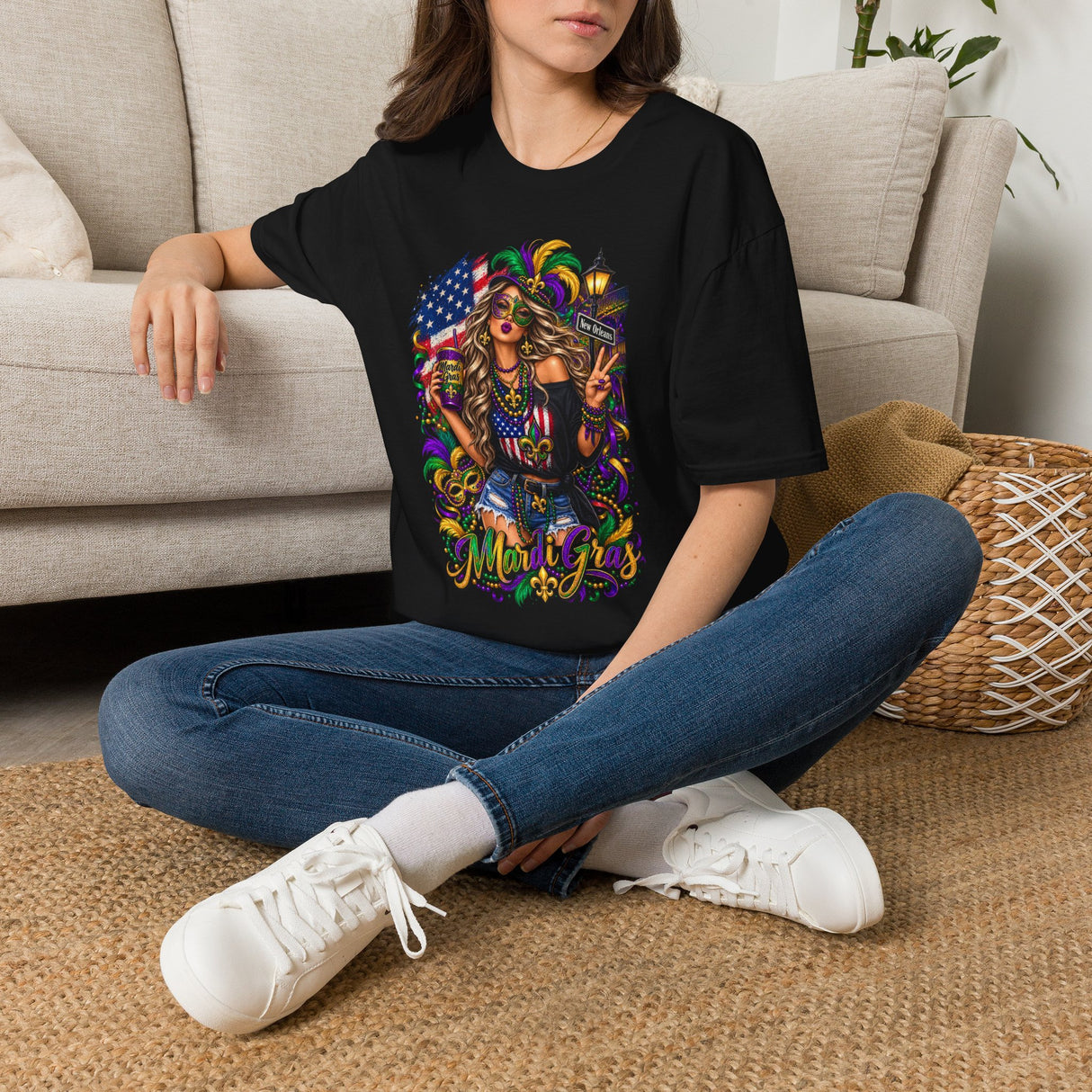 Black Mardi Gras T-shirt with colorful queen and American flag graphic, worn by model.
