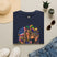 Navy T-shirt with Mardi Gras queen and American flag graphic on front