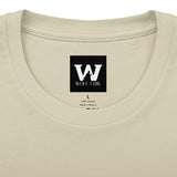 Cream crew neck tee with Wolf Claw logo patch centered at chest