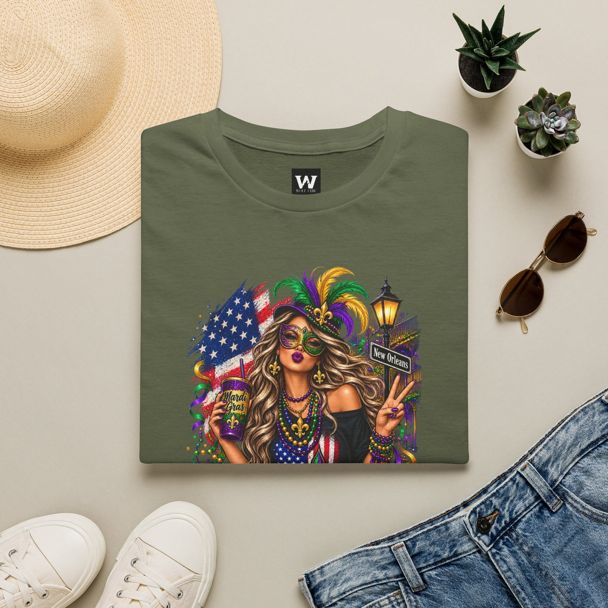 Olive green T-shirt with Mardi Gras queen and American flag graphic on front