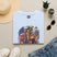 Light blue T-shirt with Mardi Gras queen and American flag graphic on front