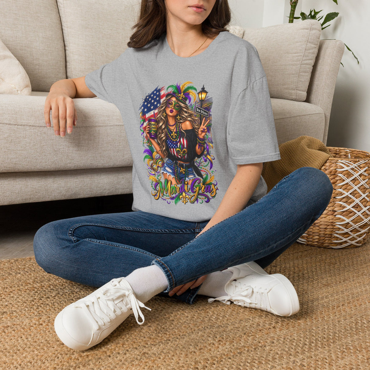 Light gray Mardi Gras T-shirt with colorful queen and American flag graphic, worn by model.